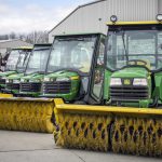 Tractors with snow brooms