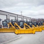 Skid loaders with snow pushers