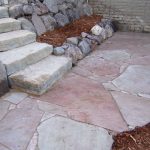 Flagstone steps and patio with boulders