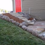 Boulder wall and flagstone steps