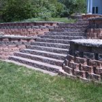 Two tiered retaining wall with stairs